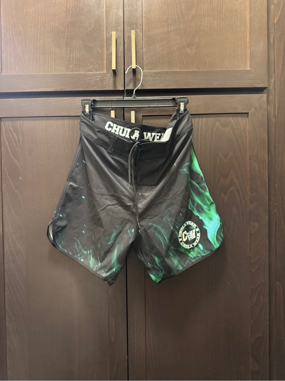 Chula Wear Men's Physique Competition Black Board Shorts with Green Flame